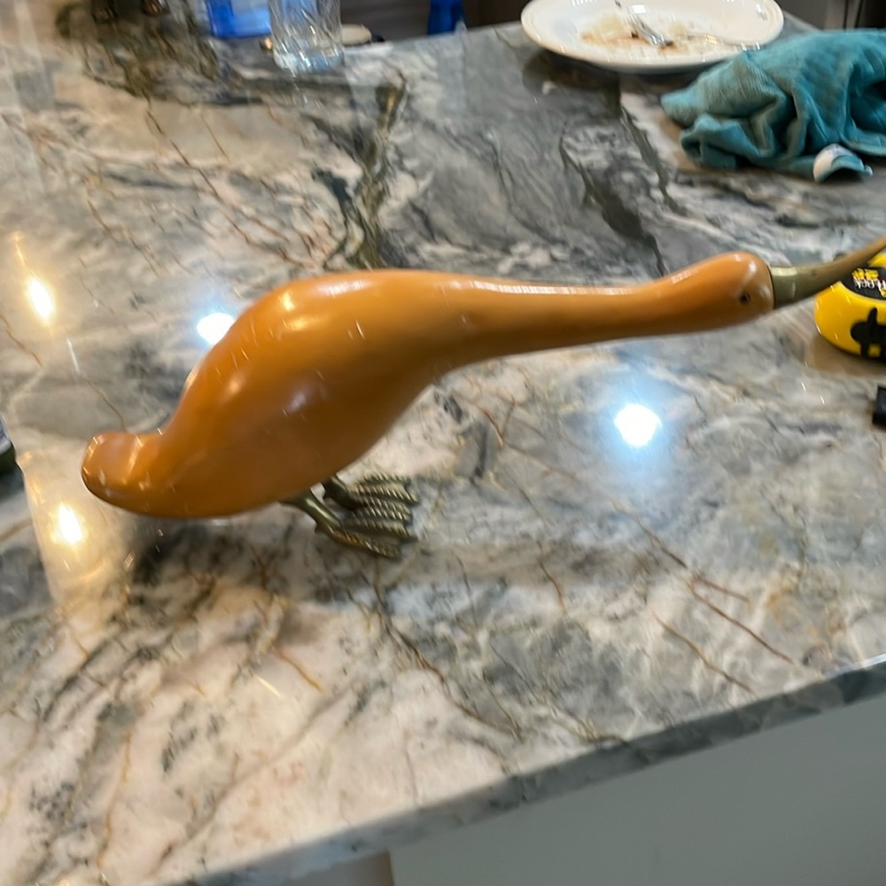 Wood and brass duck.
